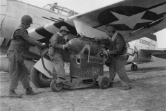 attaching 500lb bombs. June 1944