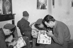 bob Bernice pit and Joe by our stove. Belgium. DEC 1944.