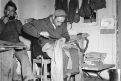 sanderson does a little sewing. ganse makes a call. Belgium. Nov 1944.