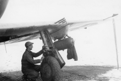 crewman works on P47 in the snow and cold. Belgium. Dec 1944