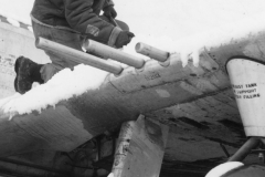 removing snow from wing of P47 after recent storm. Belgium. Jan 1944