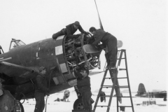 working on the engine of P47 in the snow. Belgium. Jan 1945