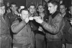 col curry and Lt col wolinsley make a toast to 10000 missions ahead. J