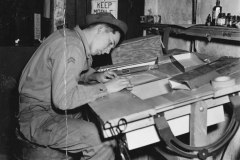 bob working at his plotting table. may 1944.