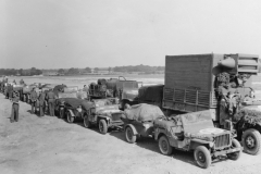 vehicles line up to be loaded on LST