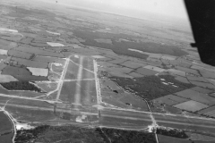 shot of section of field. ocean can be seen. may 14 1944