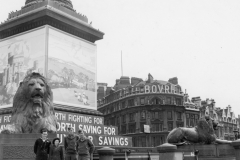 Trafalgar square with a sailor a gal and pit and Bernie.