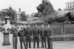 Bernie left with Canadian Scotchmen and two gis. Trafalgar sq. England