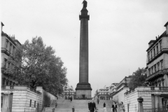 nelsons monument flanked by the old German legation on left and France