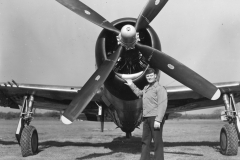 squadron CO in front of one of our planes. team a field. Kingsnorth. E