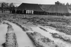 red cross tent at reins base with all the mud around us. Barbra and Ru