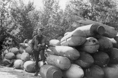 major smith by a pile of Jerry bombs at reins base. Nov 1944