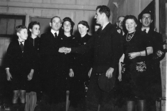 Lt Gibson greets some french people at dance. Oct 1944