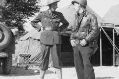 col curry talk with a British war news person. Aug 1944. France. strip