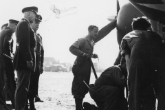 gen Patton inspects works on a plane at team b area. may 25 1944.