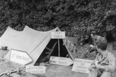 one of our tents near the beach. the signs are German. Jul 1944.