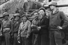 buddies and two USO gals. a German heavy tank in the background.