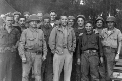 Bing Crosby with a bunch of GI Jose near doughnut dugout at Le mans. S