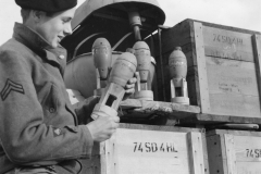 pit looks a Jerry bombs that are put in big bombs. Sept 1944.