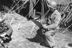 Sgt cance parints in front of tents. 391st. Aug 1944