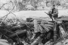 major smith looks over German bombs. ruins France.