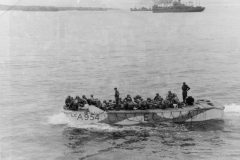 landing craft head for a french beach.