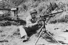 sandy mans a 50 cal German machine gun. cherbourg. France.