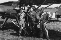 chaplain Saunders and two fellow by German plane. may 6 1945. Germany.