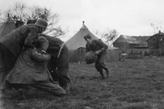 major smith has the ball. pits in German helmet. Germany. march 1945