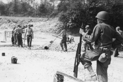 guard watches German prisoners at work. Germany. 1944