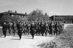 men marching to VE day ceremony at our Kassel Germany base. may 1945