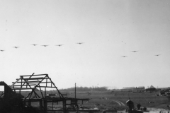 liberator roars over with surplus for our airborne soldiers. march 194