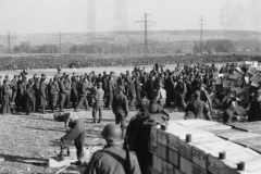 60000 German prisoners receiving c rations. near coblence base. German