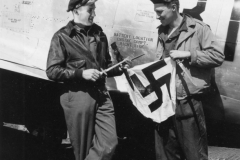 a pilot shows his crew chief a german flag